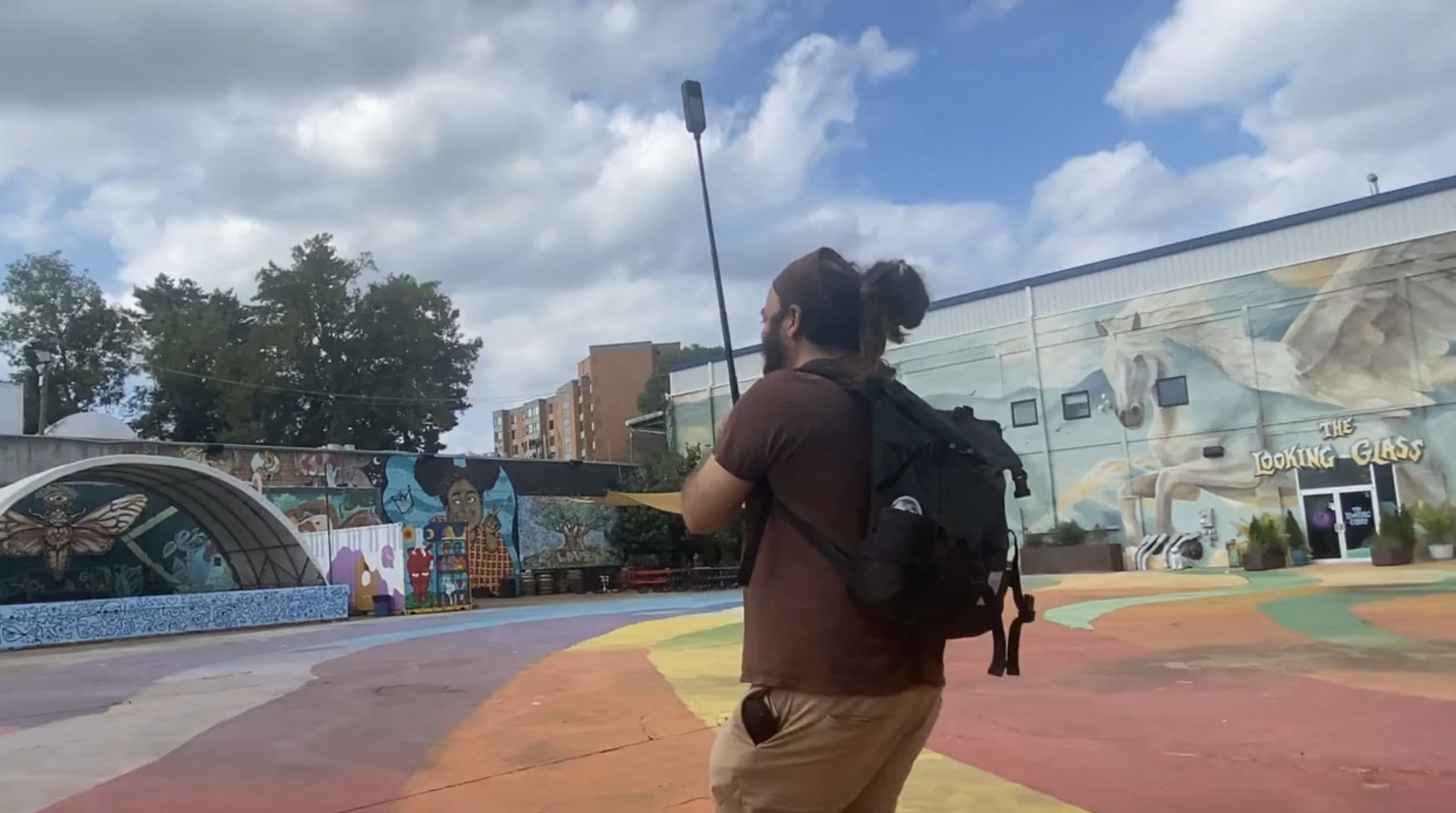 On-site capture with a pole-mounted camera in the colorful IX Art Park courtyard